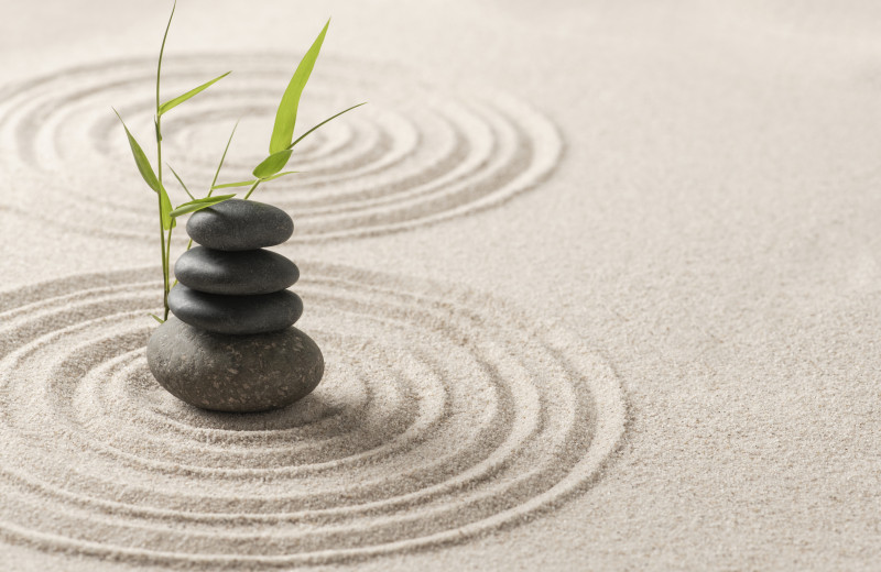 stacked zen stones sand background art balance concept